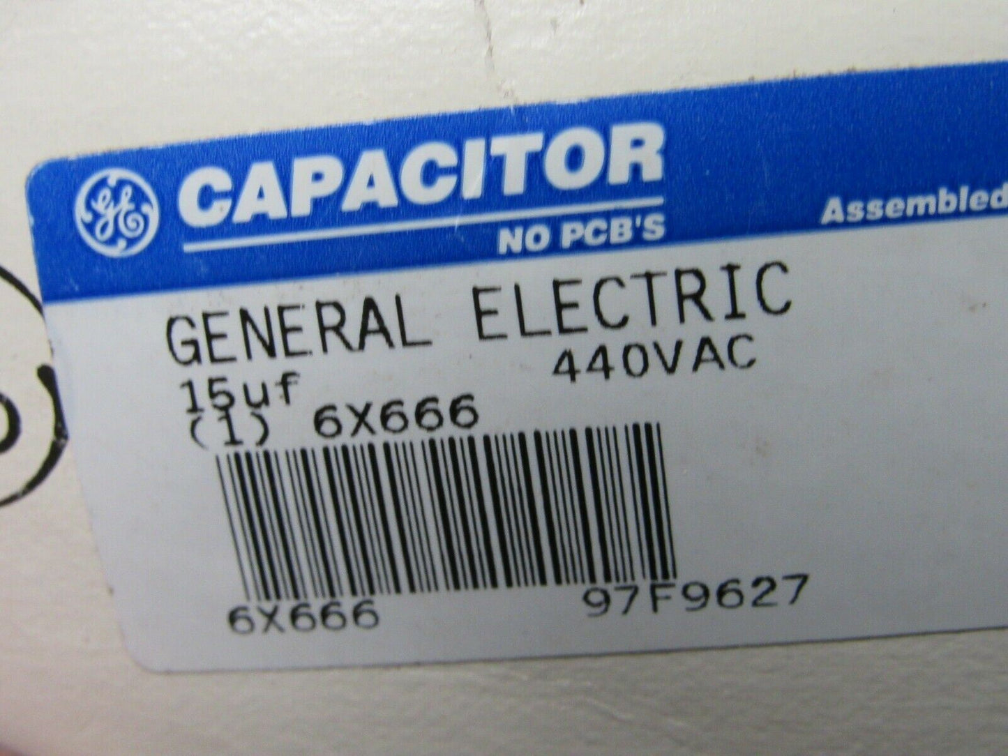 97F9627BX, GE Oval Motor Run Capacitor, 15 Microfarad Rating, 440VAC Voltage (184136974659-WTA06)