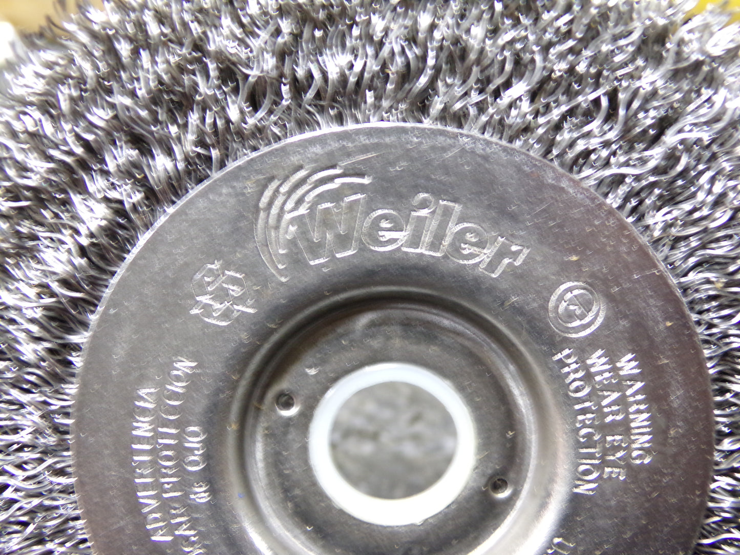WEILER 4 in Crimped Wire Wheel Brush, Arbor Hole Mounting, 0.012 in Wire Dia., 7/8 in Bristle Trim Length (CR00706-WTA18)